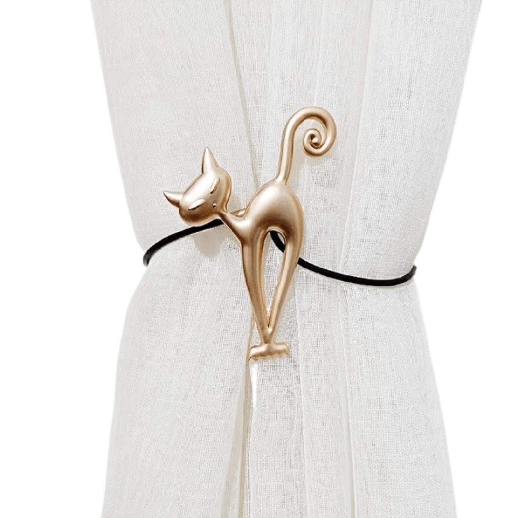 Gold metal cat curtain hook with whimsical cat silhouette