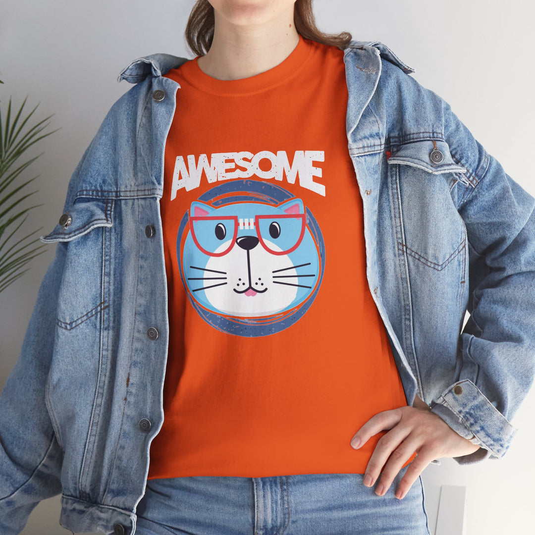 A person wearing an orange graphic T-shirt with a cartoon cat face and the word "AWESOME" in white, layered under an open light blue denim jacket and paired with blue jeans.