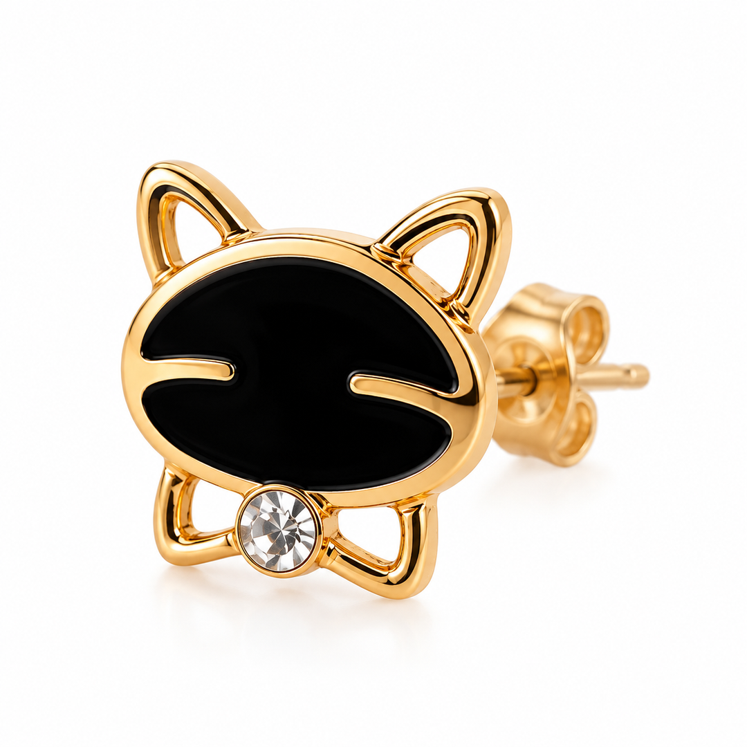 A gold-plated stud earring shaped like a cat's face, featuring a glossy black enamel face, small cat ears, and a clear rhinestone on the chin, shown on a white background.