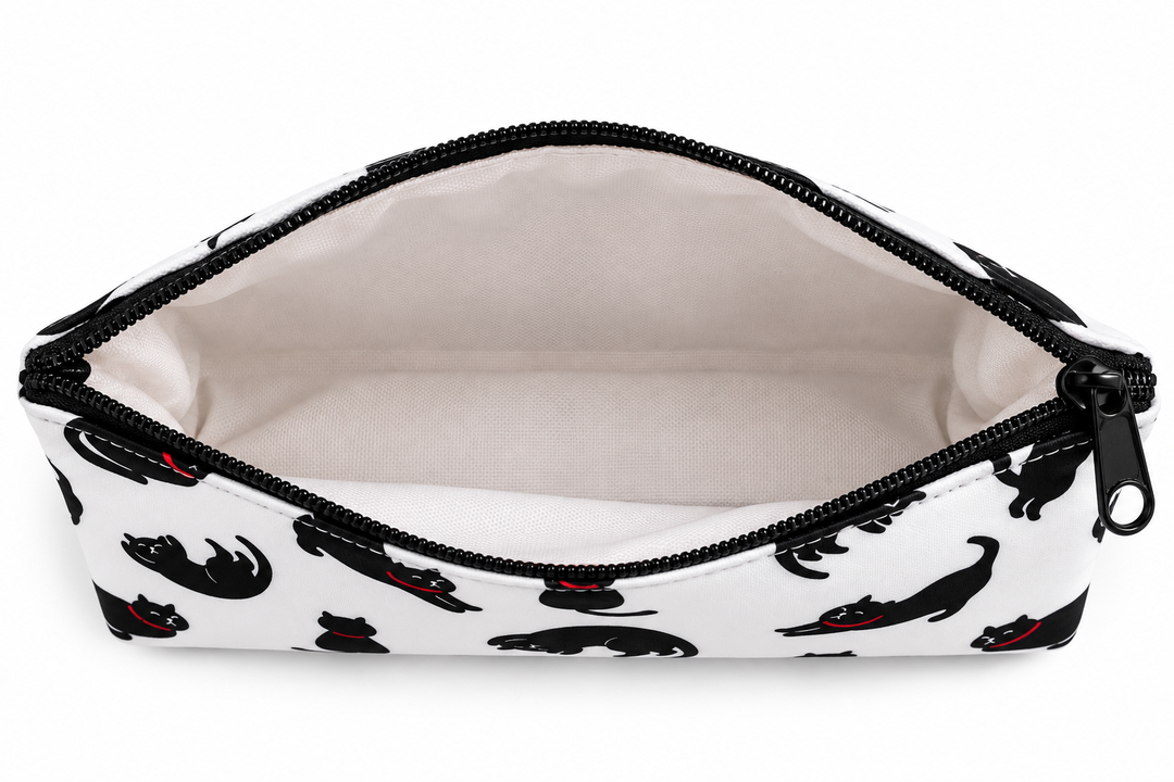 An open zippered pouch with a white exterior printed with black cat silhouettes and small red bow details, showing a light beige interior lining.