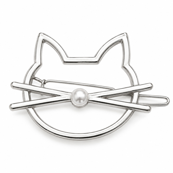 A silver-toned metal hair claw clip shaped like a cat face, featuring a small white faux-pearl at the center, shown on a plain white background.