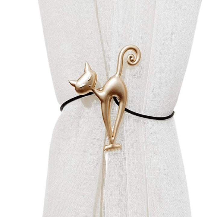 Gold metal cat curtain hook with whimsical cat silhouette