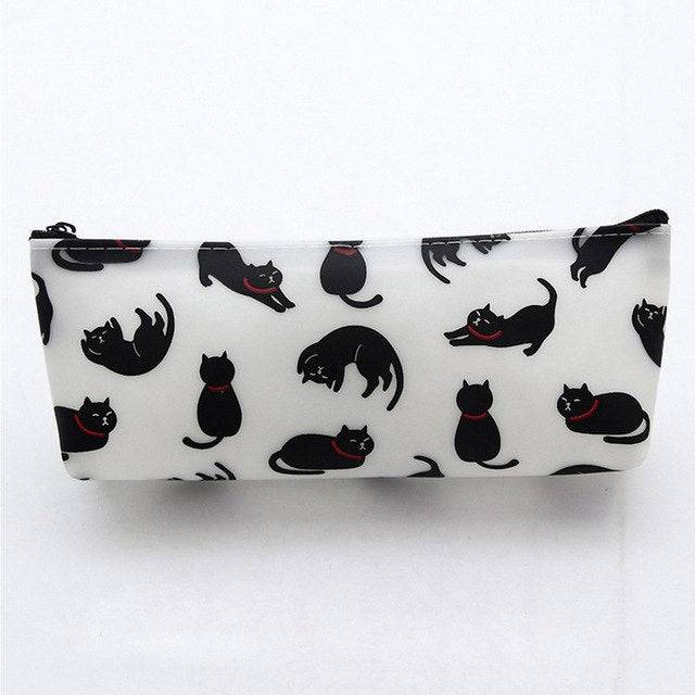 Creative Cats Pencil Case in white with playful black cats sitting, stretching, lounging and rolling in different poses, accented with red collars and finished with a black zipper